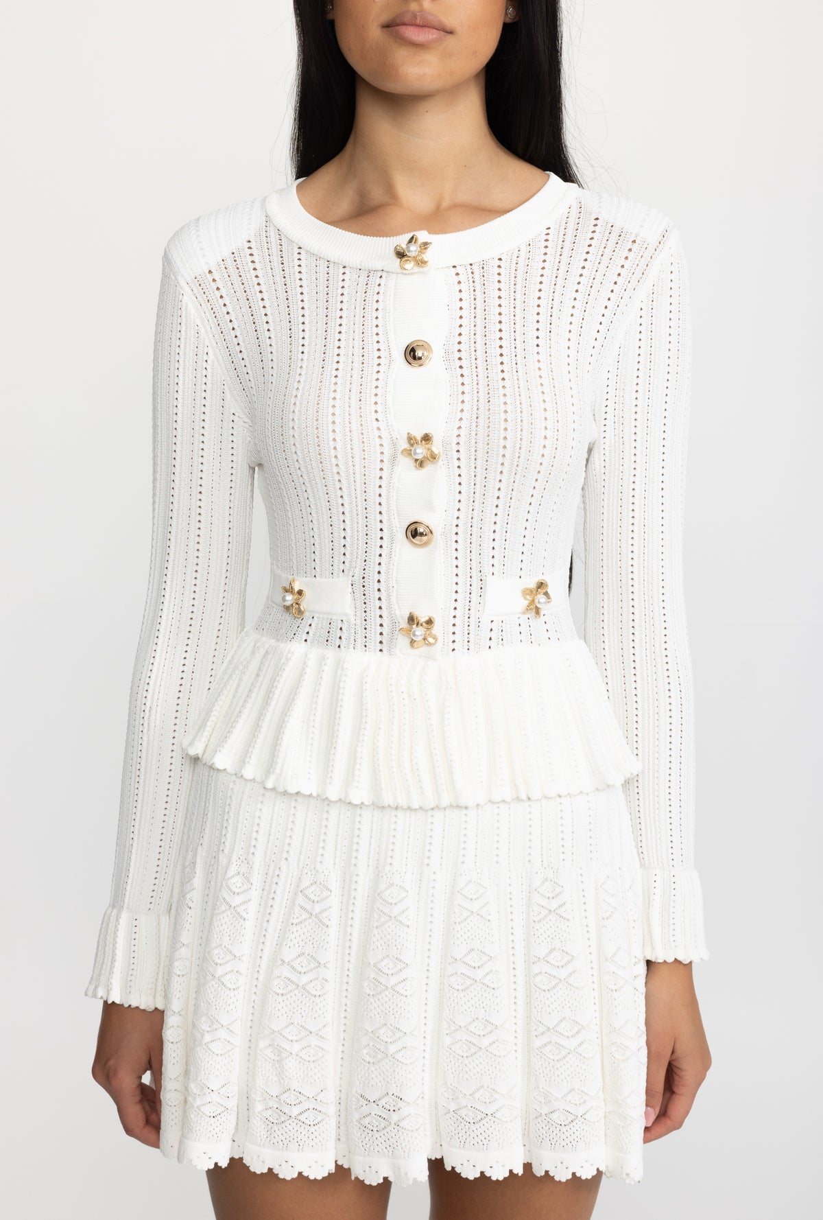 Mini abito peplum in maglia pointelle con bottoni a fiore - Bianco