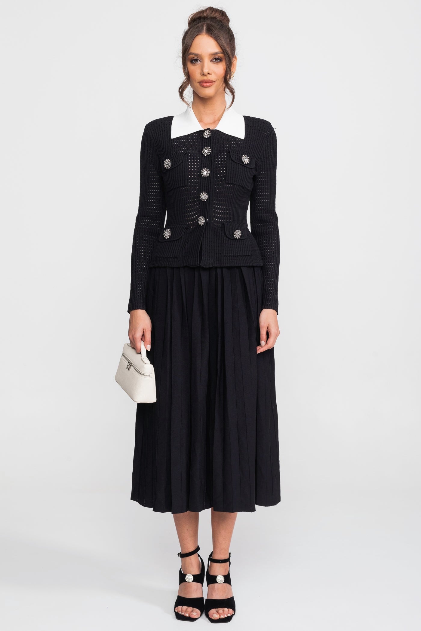 Set coordinato cardigan open-knit e gonna midi plissettata - Nero