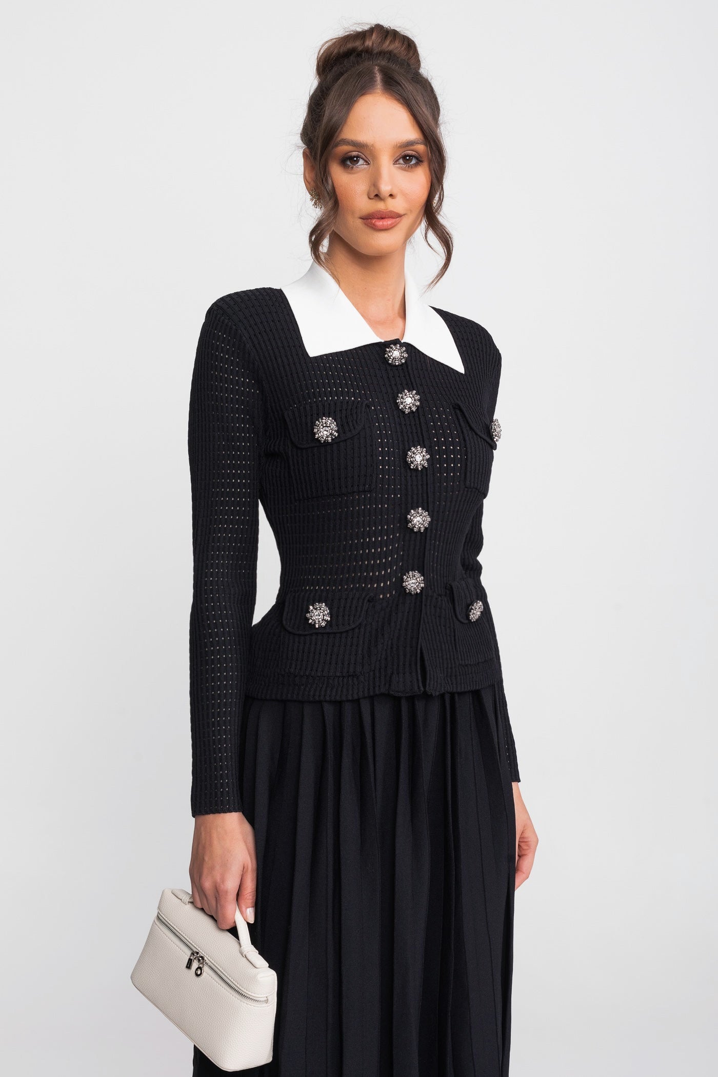 Set coordinato cardigan open-knit e gonna midi plissettata - Nero