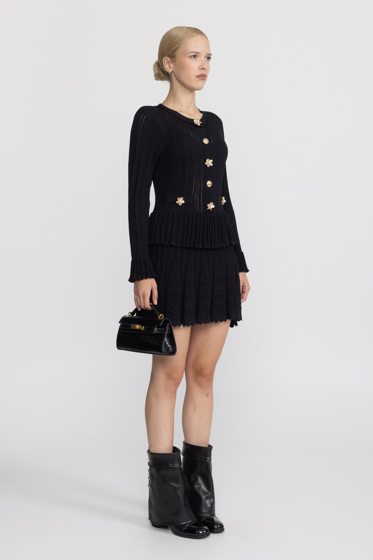 Abito mini peplum in maglia pointelle con bottoni a fiore - Nero