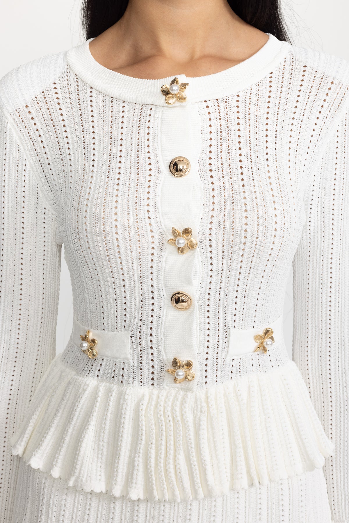 Mini abito peplum in maglia pointelle con bottoni a fiore - Bianco