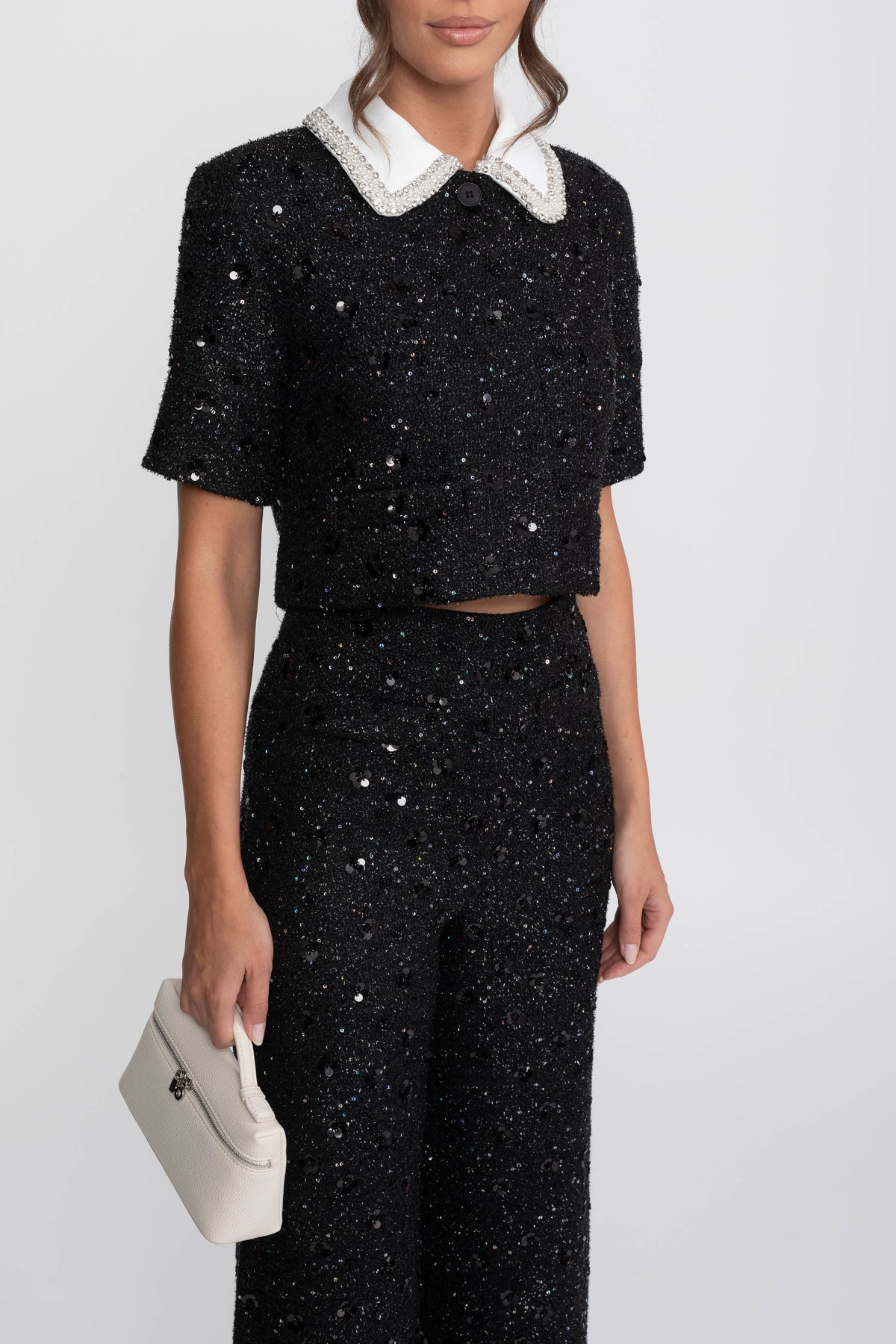 Giacca cropped in tweed a maniche corte con colletto a contrasto e dettaglio di paillettes - Nero