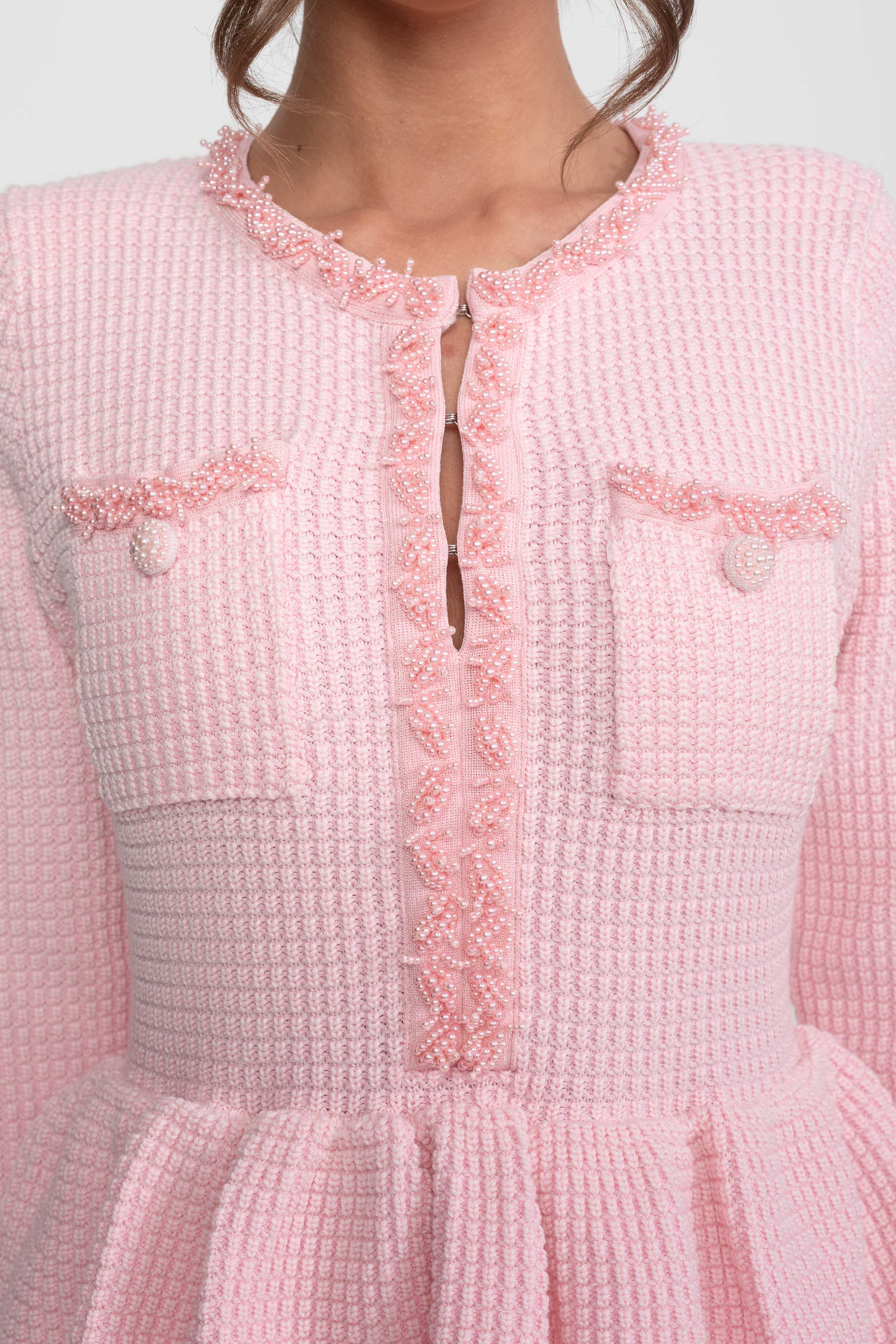 Abito Peplum in Maglia con Rifiniture Frangiate e Tasche Frontali sul Petto - Rosa