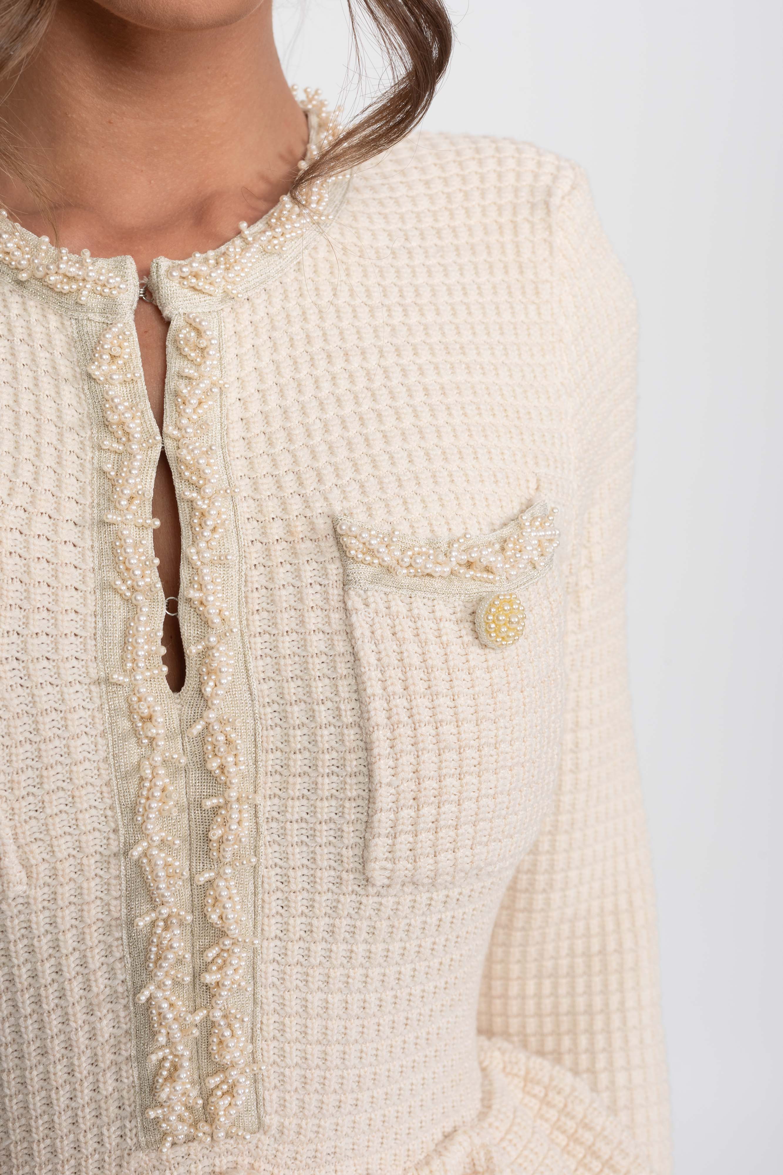 Abito Peplum in Maglia con Rifinitura Frangiata e Tasche Frontali sul Petto - Beige 